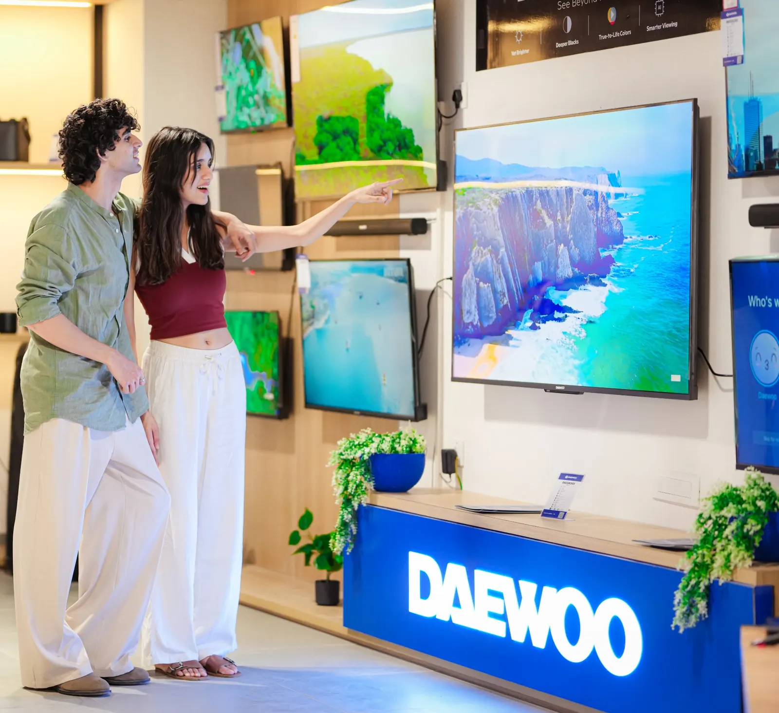 Shoppers exploring Daewoo smart TVs